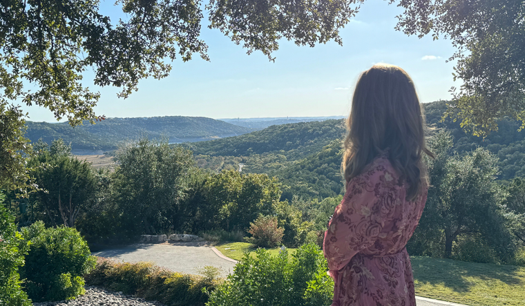 Maria looking over rolling hills.